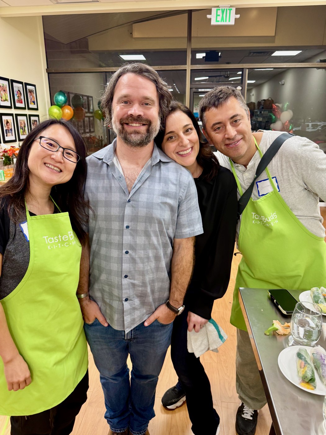 Marta and Connor, at center, with guests during Taste Buds Kitchen Bellevue’s opening weekend